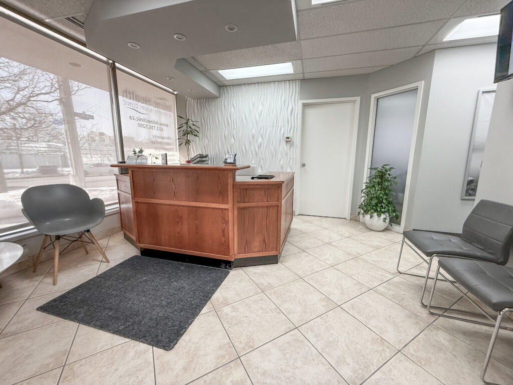 Reception area at Inline Health & Sports Injury Clinic in Ottawa showing front desk and waiting area